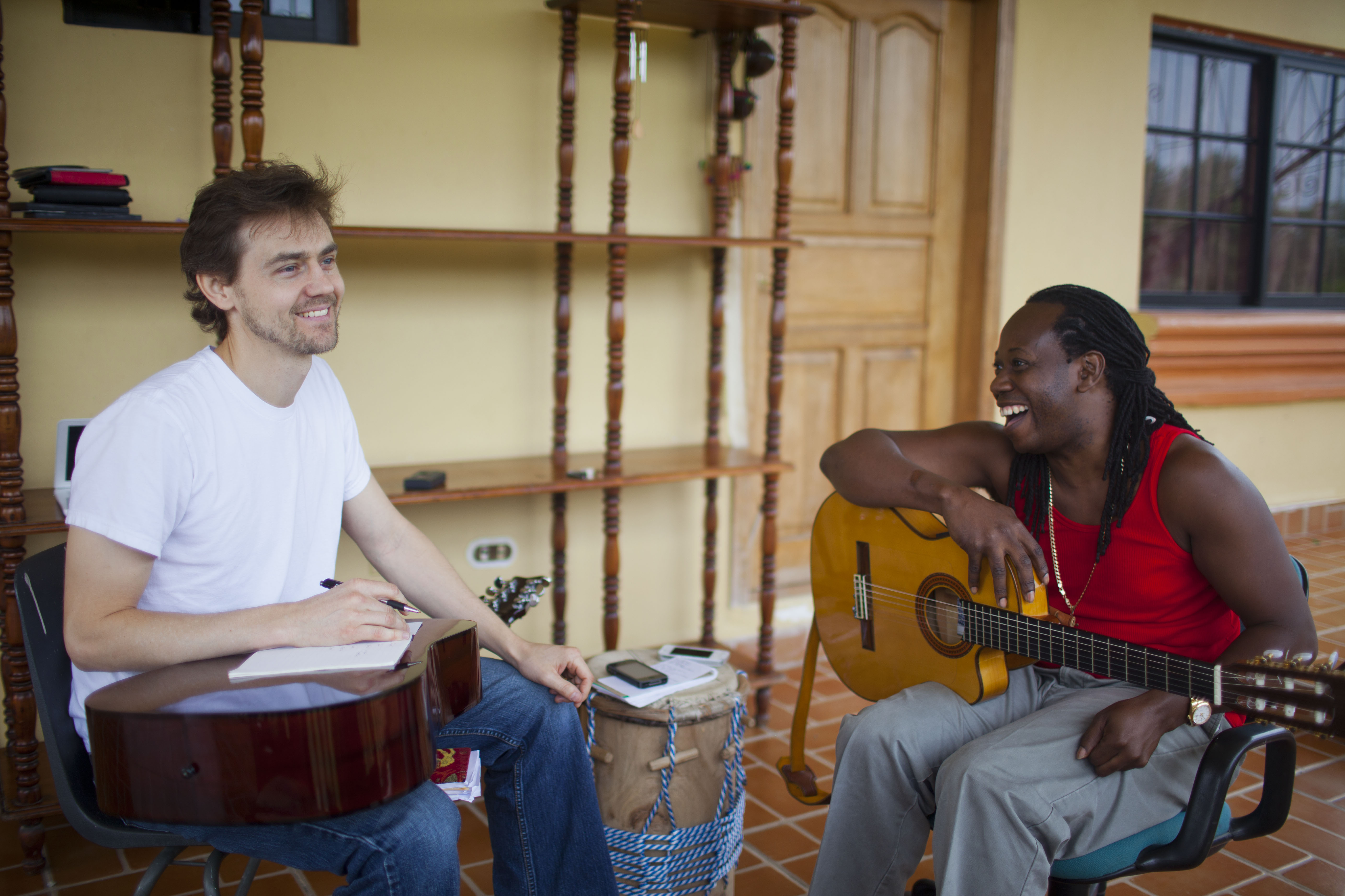 Garifuna singer-songwriter Aurelio Martinez (right), with the author, renews a passion for helping his community in Honduras. Image by David Rochkind. Honduras, 2013.