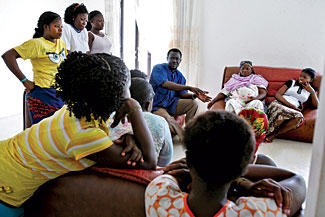 Mohammed Salifu speaks to a group of girls in Accra, Ghana, who are training there for independent work as hairdressers. Image by Peter DiCampo. Ghana, 2009. Media file: Mohammed-Salifu-Ghana-Accra.jpg