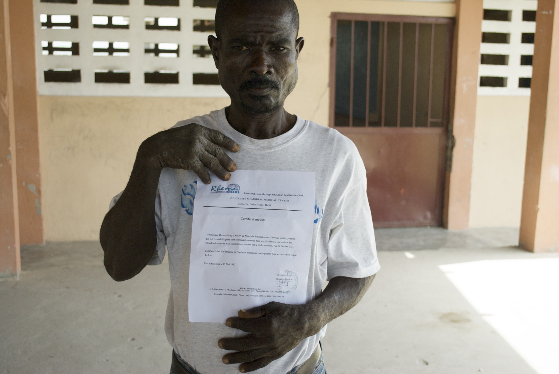 Aristide Mojes has survived cholera. The medical certificate he has received will be filed with thousands of others in a lawsuit against the United Nations. Image by Jason Hayes. Haiti, 2012. Media file: Mojes.jpg