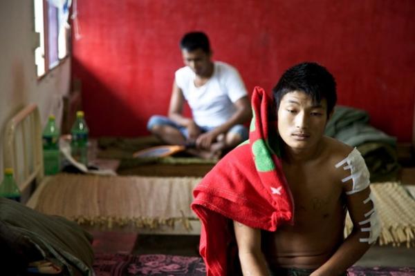 A wounded Kachin Independence Army soldier recovers in a military hospital in Laiza. Image by Jason Motlagh. Burma, 2012. Media file: Motlagh-6370.jpg