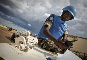 A handout picture released by the United Nations Mission in Sudan (UNMIS) shows a Namibian soldier serving with the international peacekeeping operation on the ground during a patrol in the volatile region of Abyei on May 30, 2011. Image by Stuart Price AFP/Getty Images. Sudan, 2011.