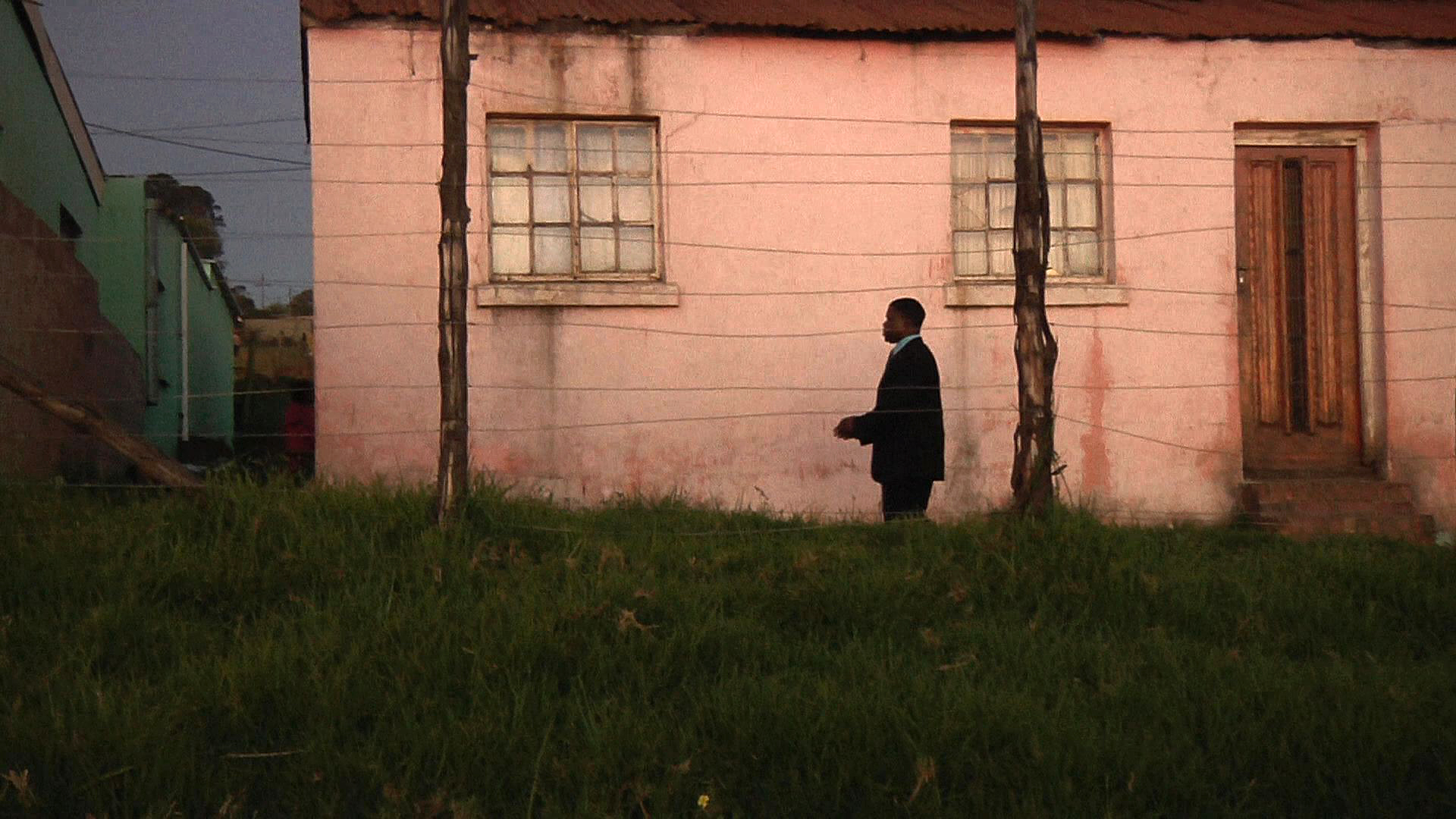 Richard Nzwana, blind since the age of 12, walks to the neighborhood church behind a small residence without the aid of a walking stick or guide. Image by Samantha Thornton. South Africa, 2012. Media file: PCStill.jpg