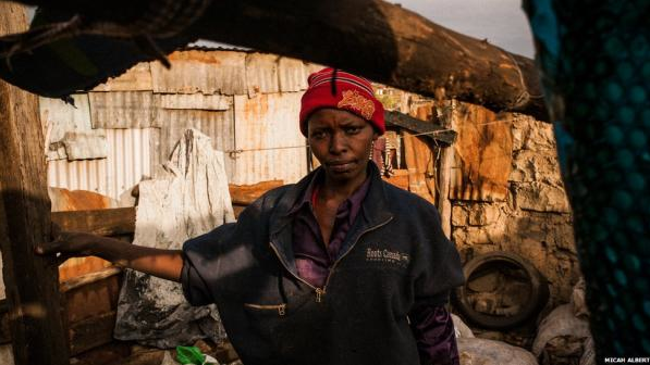 Rahab Ruguru, a 42-year-old mother of six, lives on the outskirts of Dandora. Apart from a four-year-old, Mrs Ruguru takes her whole family scavenging on weekends and after classes - to earn money for school fees, books and uniforms. No matter what regulations the bureaucrats in Nairobi may issue, she does not see a time when they will stop picking through Kenya's leftovers. “If this site moves, then I will move with it - or we will not survive,” she says. Image by Micah Albert. Kenya, 2012. Media file: Picture 2.png