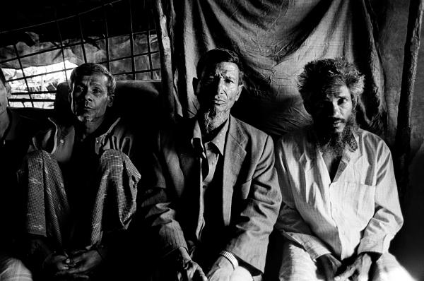 Over the past 30 years, several waves of Rohingya have fled oppression in Burma and have settled in southern Bangladesh. Unwanted and unwelcome in Bangladesh, they are denied refugee status and most humanitarian assistance, making them especially vulnerable to exploitation and violence. These Rohingya men left Burma years ago when Burmese authorities arbitrarily seized their land. Image by Greg Constantine. Bangladesh, 2012. Media file: Rohingya001.jpg