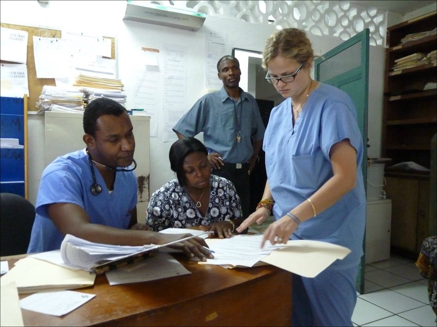 Doctors and nurses prepare the day's rounds of chemotherapy on cancer patients at Zanmi Lasante's clinic. Image by Ansel Herz. Haiti, 2012.
