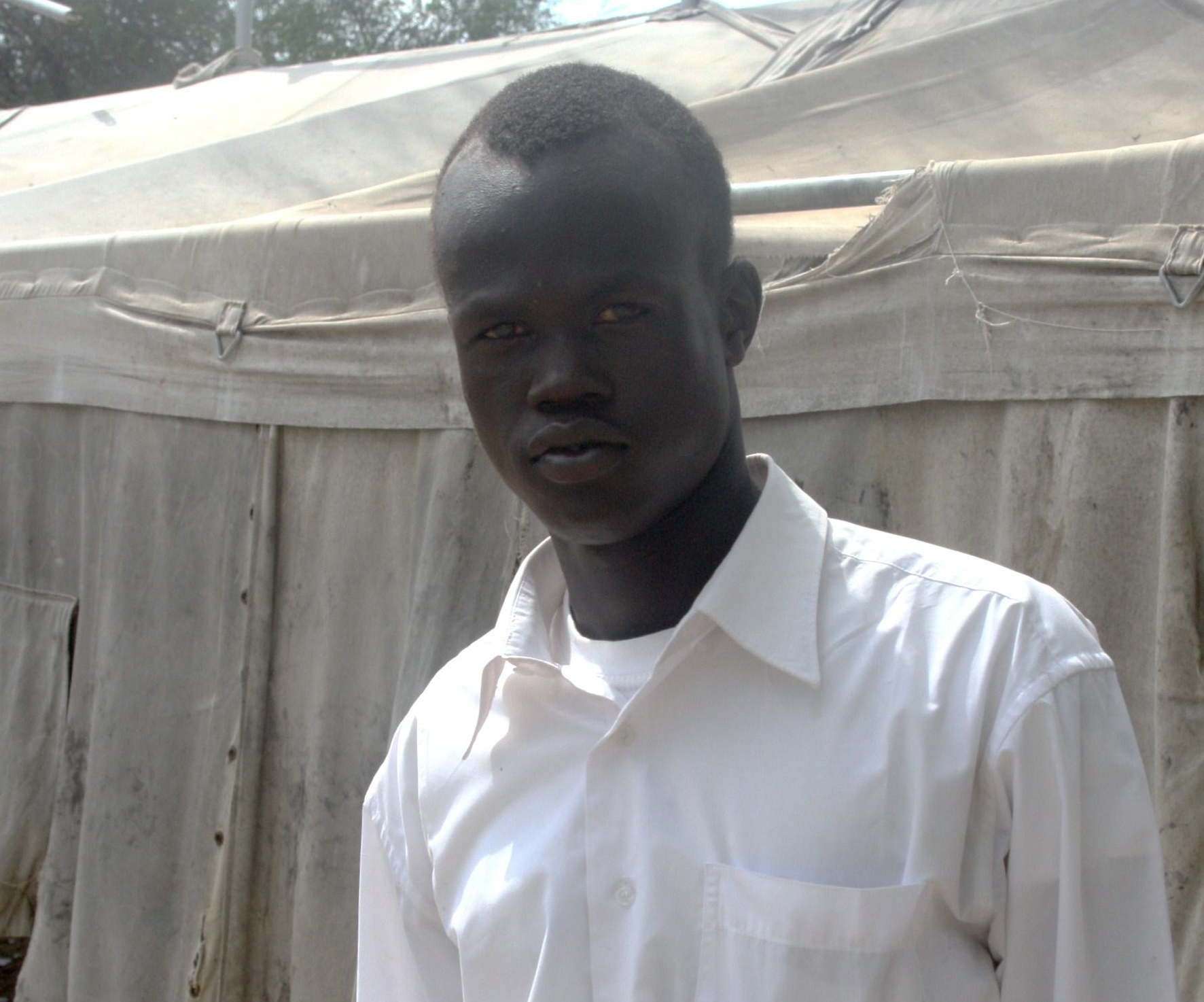 Lual Kuol Lual is a student at a primary school in Agok, Sudan. Many primary school students in the south are in their teens, repeating their educations after relocating home from the north following the Comprehensive Peace Agreement. Image by Rebecca Hamilton. Sudan, 2010.