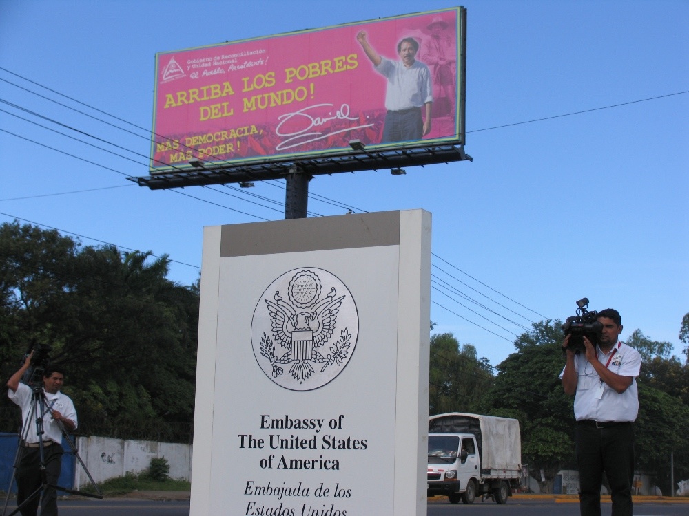 Press set up outside of the U.S. Embassy in Nicaragua. The Embassy announced a $3 million cut in aid in response to the 2011 election process and Nicaraguan handling of Venezuelan petro dollars. Image by Tim Rogers. Nicaragua, 2012. Media file: TimRogersEmbassy.jpg