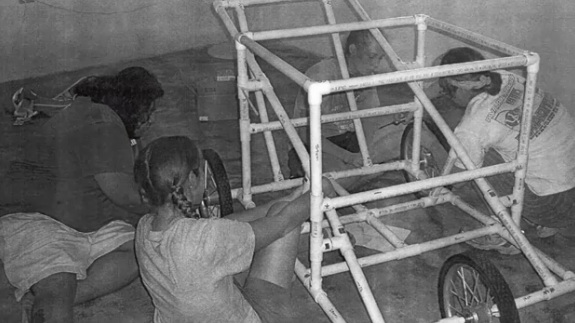 Nerinx Hall InvenTeam members build a portable water treatment wagon.