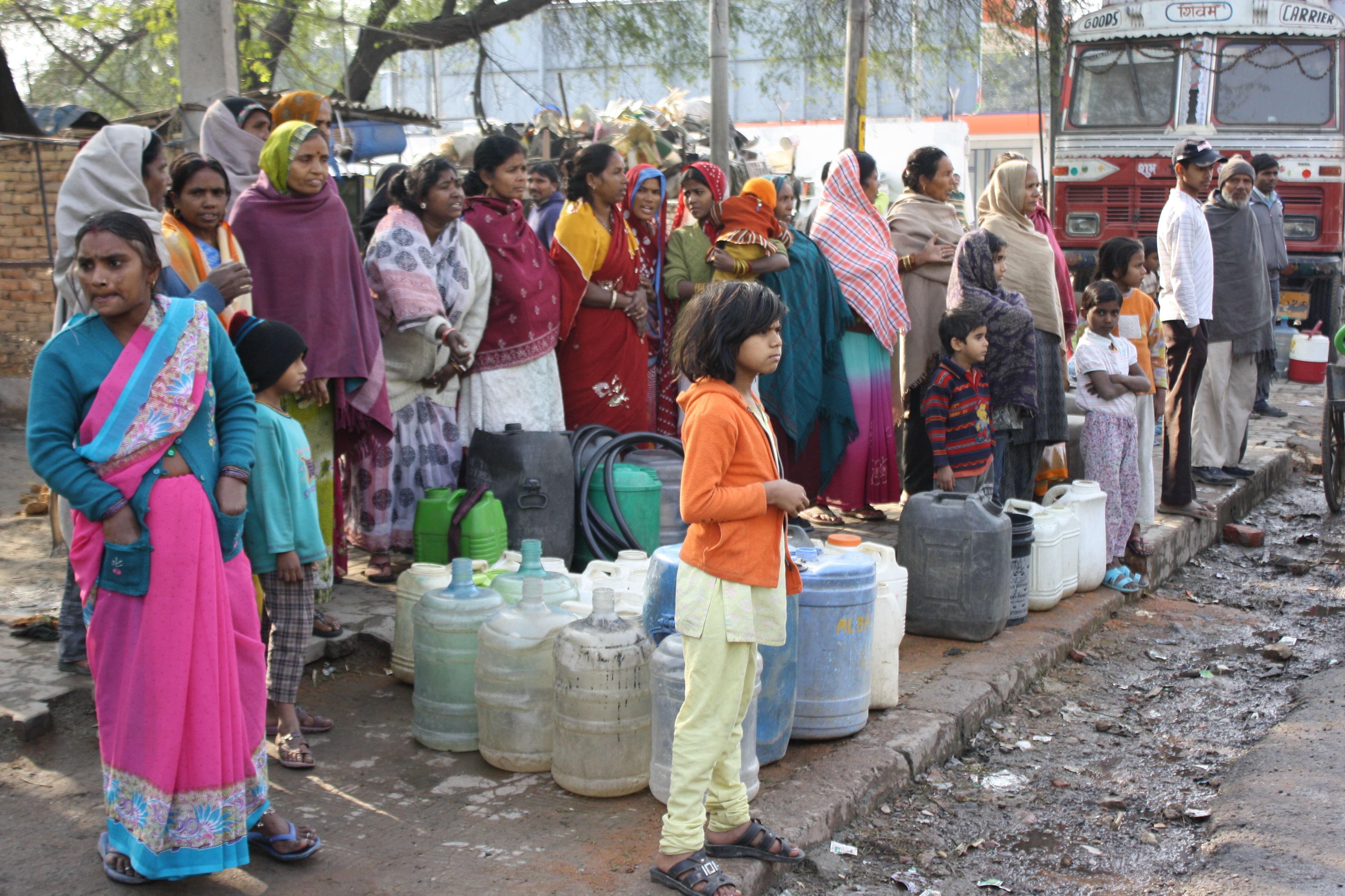 People in the Vasant Kunj neighborhood spend four to six hours a day waiting for clean water. Image by Nicole See. India, 2011.