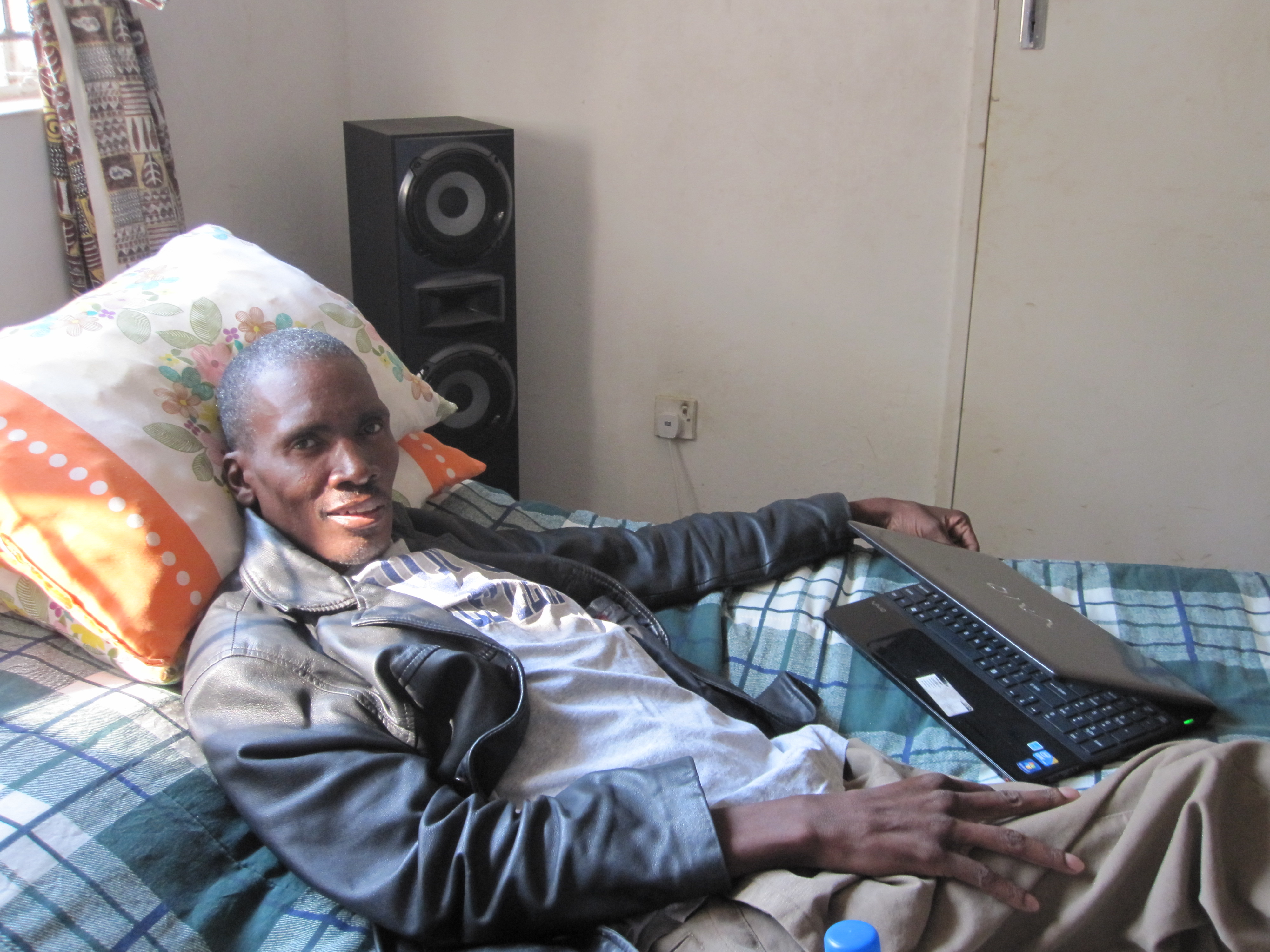 Winstone Zulu, a Zambian HIV/AIDS activist who spent the last 20 years of life spreading awareness about the disease that eventually killed him. Image by Antigone Barton. Zambia, 2011.