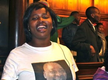 A female ANC supporter wears a shirt supporting President Zuma. It reads "Together we can build better communities." While Zuma has angered many feminists, he also has staunch supporters, especially among women in his own political party. Image by Melissa Turley. South Africa, 2012. Media file: Zuma_SouthAfrica.jpg