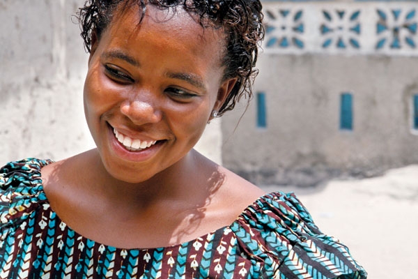 A long road: Neema John’s earliest memory is the slaying of her Hutu father in Rwanda. She lived in refugee camps until she ran from rapists. She’s raising son Briton, 4, alone. Image by Mary Wiltenburg. Tanzania, 2009. Media file: article_photo1.jpg