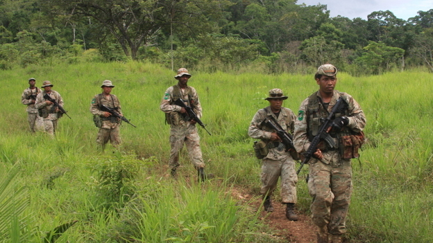 Special forces troops in Belize march through jungle looking for any sign of drug smugglers. Drug traffickers have become increasingly active in Belize and other small nations in Central America. Image by Nick Miroff. Belize, 2011. Media file: belize_special_forces2_wide.jpg