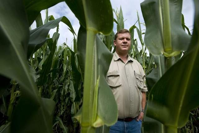 Tommie Olckers is production manager for Schoeman Estates, which controls 23,000 acres at Delmas, South Africa. Biotech corn “makes your management easier,” he says. Image by Paul Botes for the Des Moines Register. South Africa, 2010.