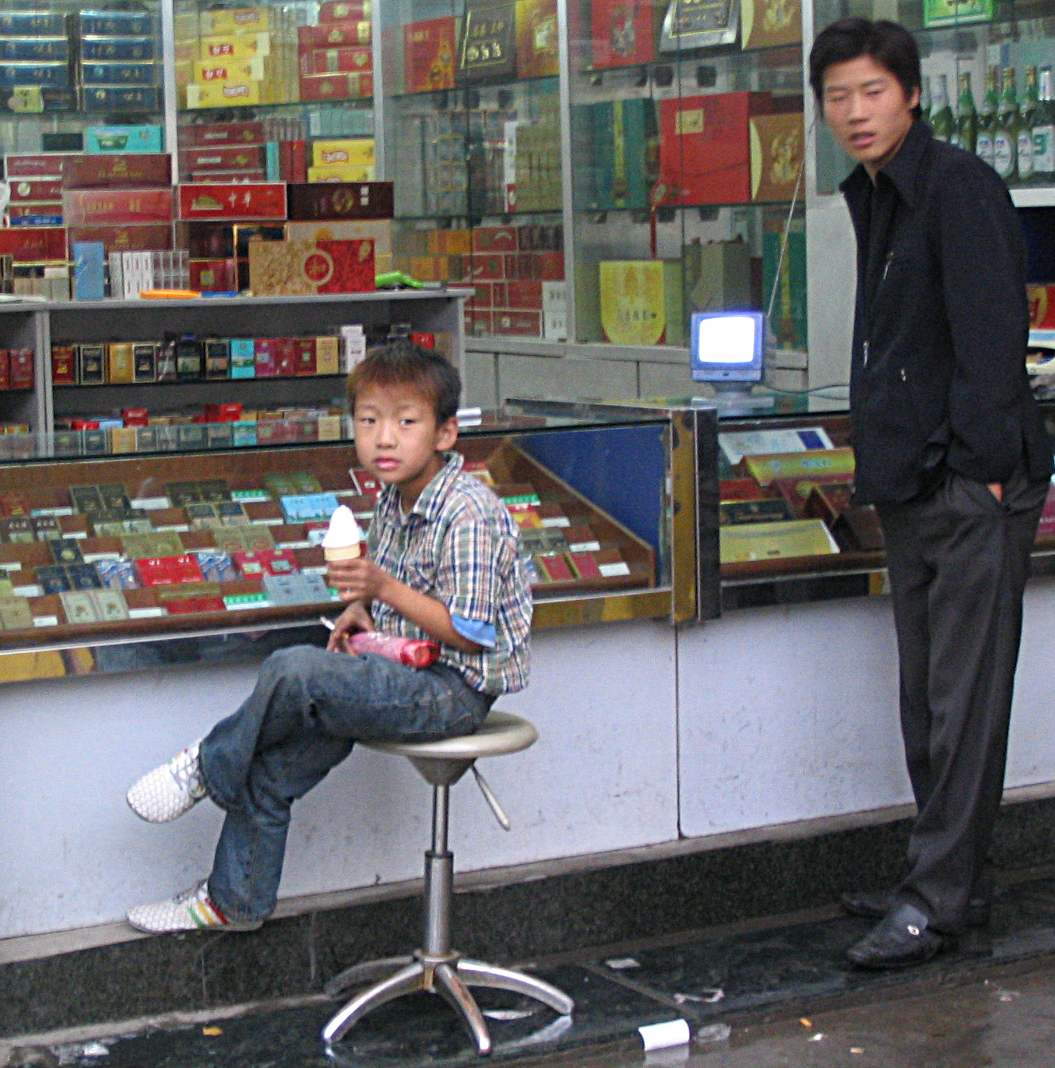 Child smoking with ice cream cone. Image by Chase Tingley via Flickr. Xi'an, China, 2004. Media file: china.jpg