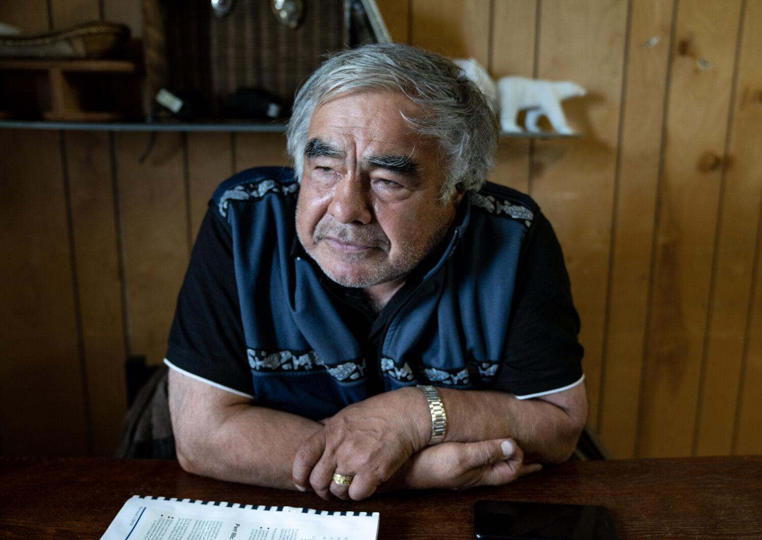 Robert Thompson, Kaktovik polar bear guide, sitting at the table. Image by Nick Mott. United States, 2019. Robert Thompson, Kaktovik polar bear guide, sitting at the table. Image by Nick Mott. United States, 2019.