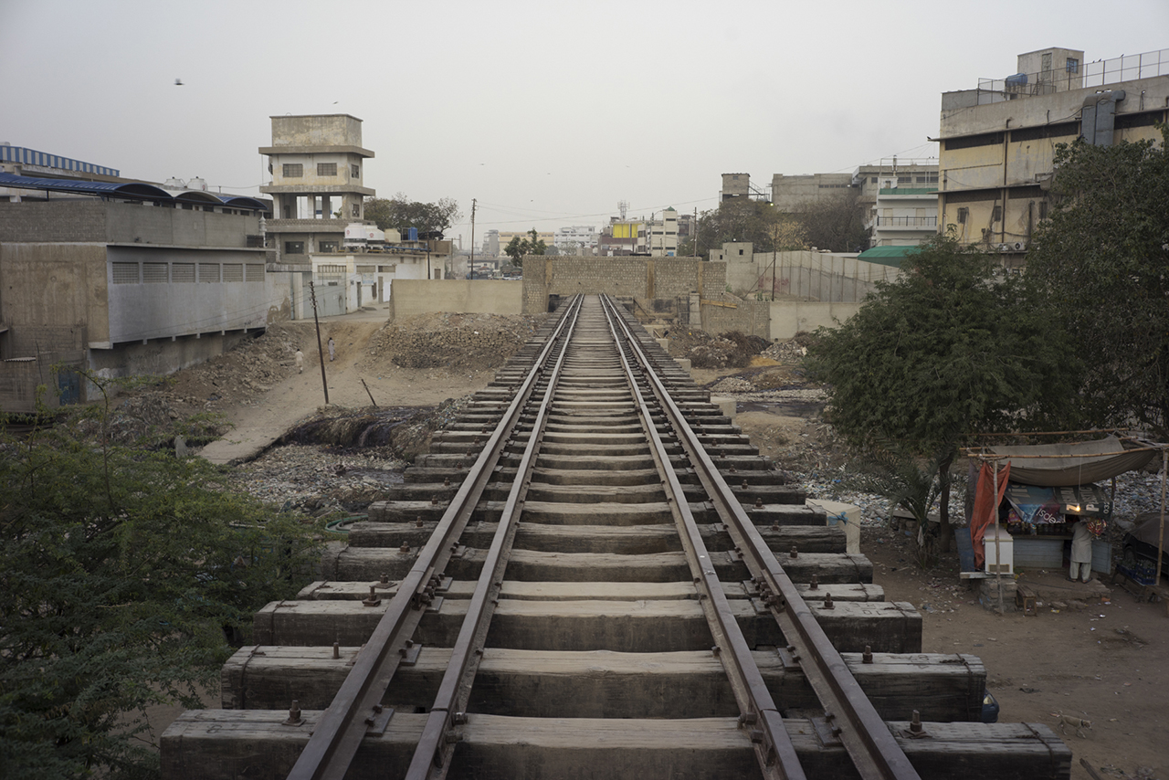 Wall Across Trestle Bridge, Orange Town Station, Karachi, Pakistan. Image from KCR, by Ivan Sigal. Pakistan, 2014-2017. Wall Across Trestle Bridge, Orange Town Station, Karachi, Pakistan. Image from KCR, by Ivan Sigal. Pakistan, 2014-2017.