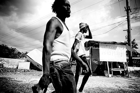 Men walk along the path from Spanish Town to St. Jago. These communities have been paralyzed by political violence and poverty for years. These social conditions have made it easy for HIV to become an epidemic. Image by Joshua Cogan. ©Joshua Cogan, 2008. Jamaica, 2008. Media file: feature-secrets_taboos.jpg