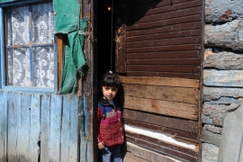 A young Roma girl stands in her home in the Chesmin Lug refugee camp in March 2009. The camps of Chesmin Lug and Osterrode are known to have been built on a toxic waste site, beside the largest lead mine in Eastern Europe, leading to lead poisoning and health problems for its residents. The Roma were initially driven from their homes following the Kosovo war of 1999. 1
