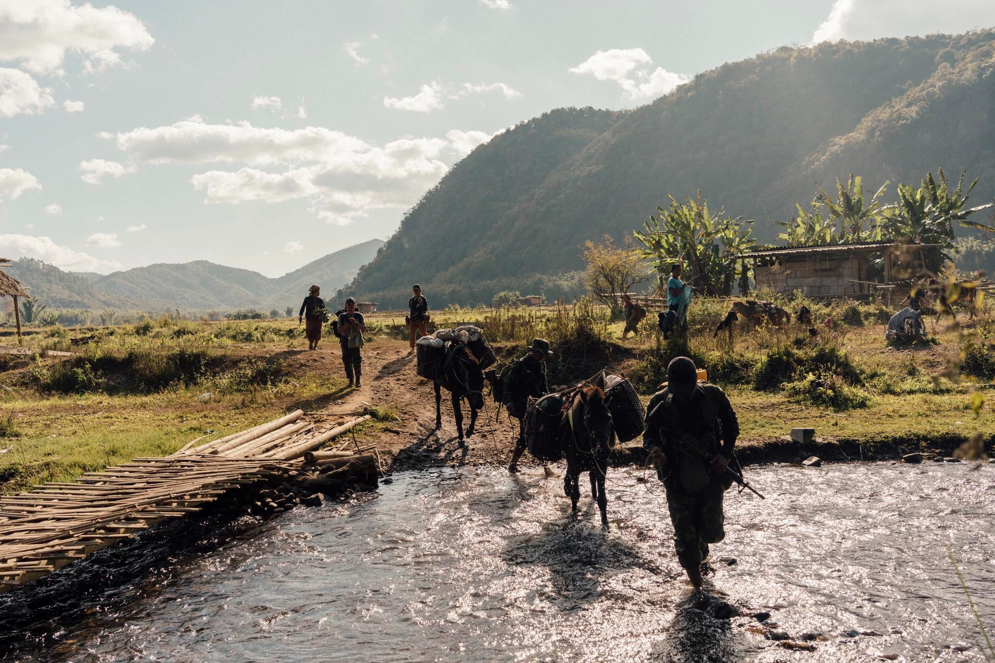 Young Asian woman wears sport black leggings runs on rural road in tropical  rain forest in