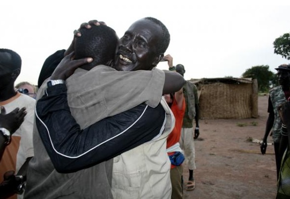 Koor Garang meets his father for the first time in almost 20 years. Image by Gabriel Bol. Sudan, 2007. Media file: lost.boys_.sudan_.jpg