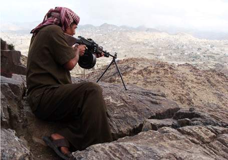 Mohamed Tamah, a leader of the south Yemen separatist movement, gets some target practice outside his village in Yafa. Media file: mercenary.jpg