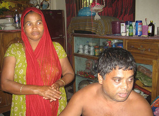 Ali Abbas has managed to provide a comfortable life for his wife (pictured) and family by working abroad. 1