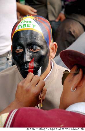 A Tibetan protester has his face painted in Dharamsala, India, the home of the Dalai Lama's government-in-exile. Media file: mn_tibet.jpg