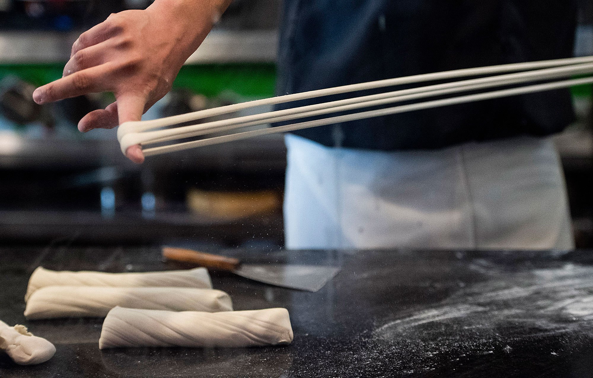 Tony Mao makes noodles at Everyday Noodles in Squirrel Hill. Image by Stephanie Chambers. United States, 2018. Tony Mao makes noodles at Everyday Noodles in Squirrel Hill. Image by Stephanie Chambers. United States, 2018.
