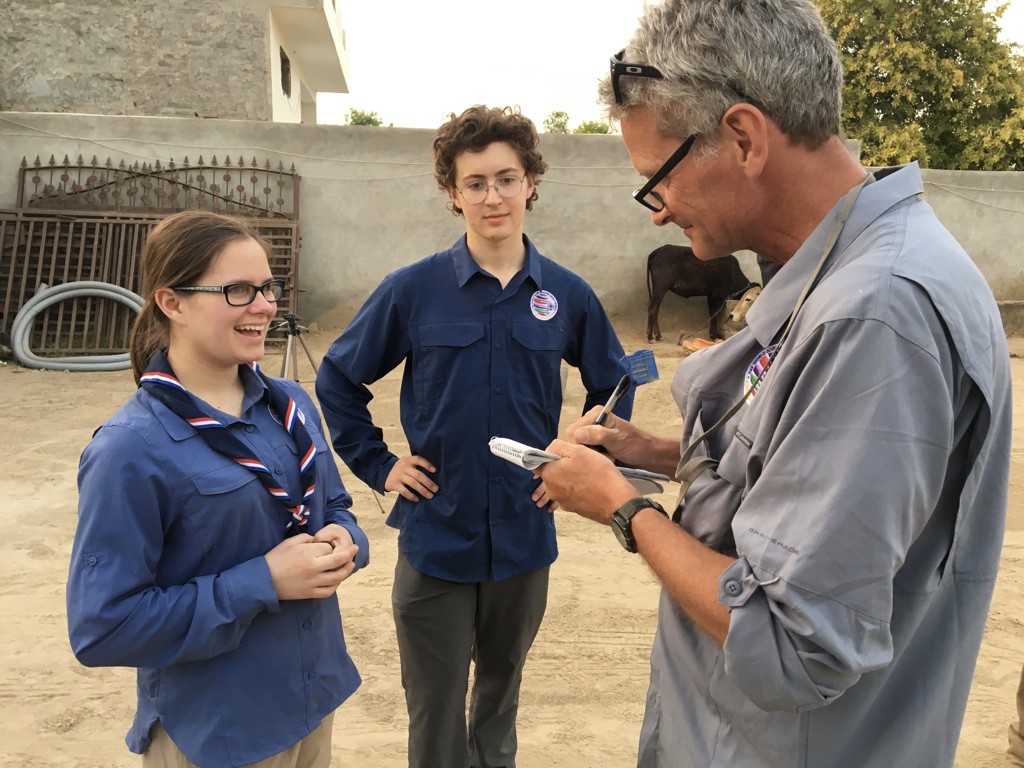 Soaking up the craft: Miciah Thacker, left, and Chris Sherman with Paul Salopek in northern India. Image by Mark Schulte. India, 2018. Soaking up the craft: Miciah Thacker, left, and Chris Sherman with Paul Salopek in northern India. Image by Mark Schulte. India, 2018.