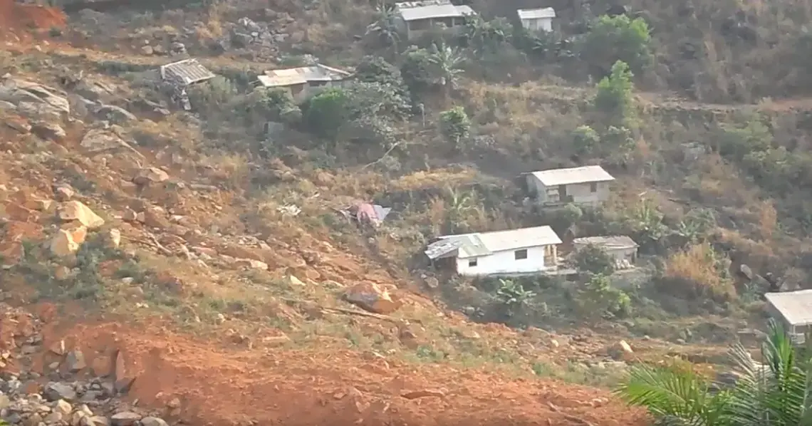 The scarred site of Sugar Loaf Mountain that came tumbling down August 2017 claiming the lives of more than 1,000 Sierra Leoneans. Image by Kadia Goba. Sierra Leone, 2018. The scarred site of Sugar Loaf Mountain that came tumbling down August 2017 claiming the lives of more than 1,000 Sierra Leoneans. Image by Kadia Goba. Sierra Leone, 2018.