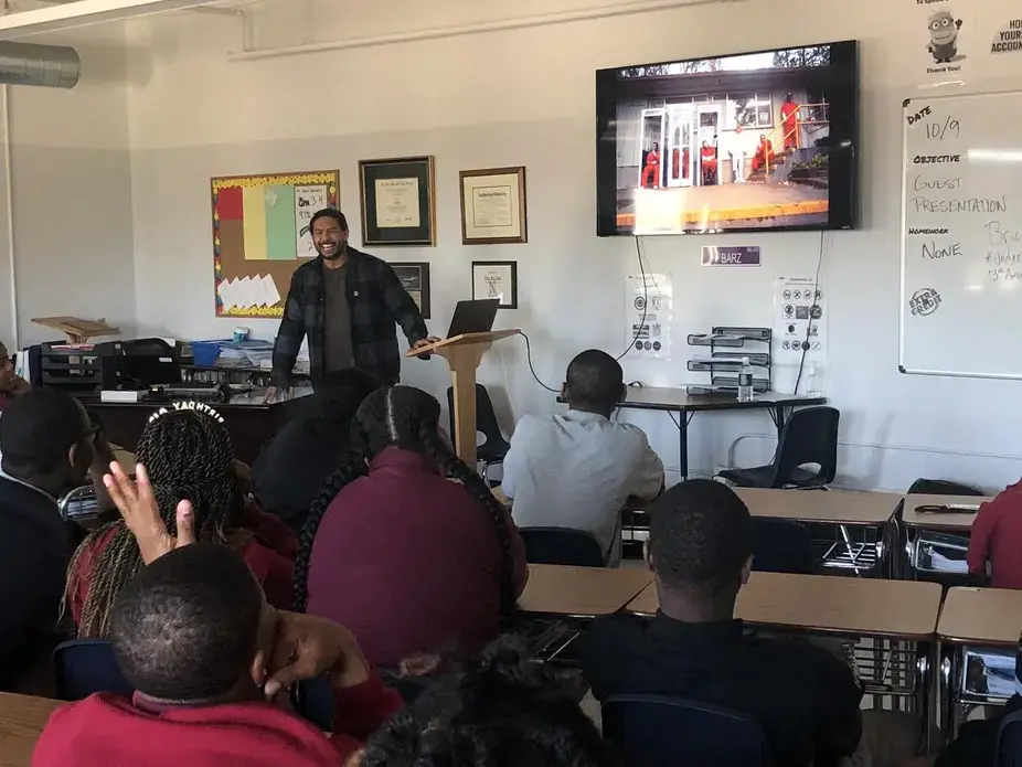 Brian Frank presents his work on incarcerated firefighters and the juvenile justice system at Legal Prep Charter Academy. Image by Hannah Berk. United States, 2019.<br />
