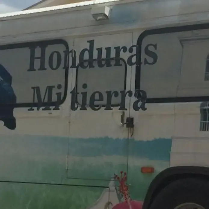 A bus in San Pedro Sula awaits deportees from detention centers in the US. Image by Emily Gogolak.