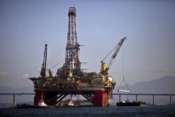 An oil platform sits under repair in Guanabara Bay, near Niteroi, Brazil. The discovery of the offshore oil reserves made some believe that Brazil could produce up to 5.3 million barrels of crude per day by 2020, putting the nation on par with production in Venezuela and Mexico. Image by Dado Galdieri / Bloomberg News. Brazil, 2013. Media file: 25082321_h1313599.jpg