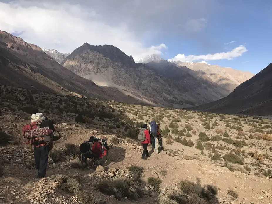 Journalist Paul Salopek took this photo of guides and walking partners in 2017 as the group entered the Gilgit-Baltistan region of Pakistan. Salopek is on what he calls the Out of Eden Walk, a years-long journey to trace the path of human migration. He started the walk in 2013, and originally planned to finish this year. He has realized he needs more time to practice “slow journalism” — seeing, listening and experiencing new things. Image by Paul Salopek. Pakistan, 2017. Journalist Paul Salopek took this photo of guides and walking partners in 2017 as the group entered the Gilgit-Baltistan region of Pakistan. Salopek is on what he calls the Out of Eden Walk, a years-long journey to trace the path of human migration. He started the walk in 2013, and originally planned to finish this year. He has realized he needs more time to practice “slow journalism” — seeing, listening and experiencing new things. Image by Paul Salopek. Pakistan, 2017.