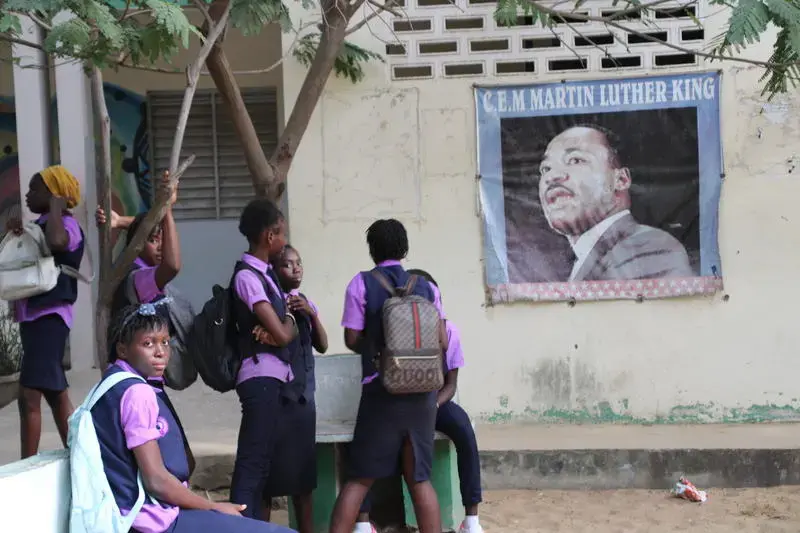 Students at Martin Luther King Jr. Middle School in Dakar, Senegal, relax after classes. Image by Michelle Tyrene Johnson. Senegal, 2019.