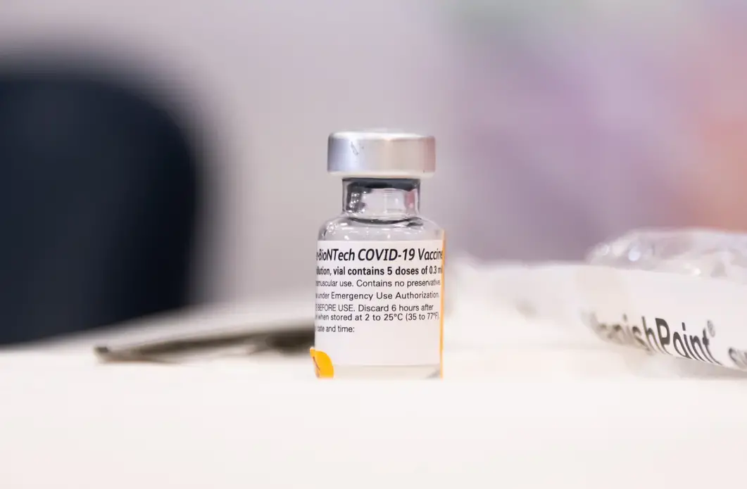 A vial of the Pfizer-BioNTech COVID-19 vaccine. Image by noamgalai / Shutterstock. United States, 2020. A vial of the Pfizer-BioNTech COVID-19 vaccine. Image by noamgalai / Shutterstock. United States, 2020.