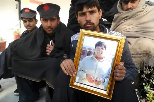 A student holds a portrait of Aitzaz at his school in Hangu, Pakistan. Image by The Friday Times. Pakistan, 2014. Media file: tft-49-p-1-e-600x400.jpg