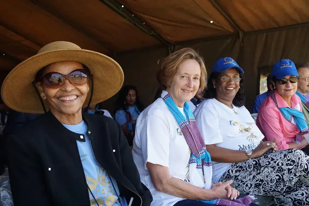 KMG Founder Bogeletch Gebre; Anna Clark, the wife of former EU Delegation Ambassador Timothy Clark; Israeli Ambassador to Ethiopia Belaynesh Zevadia; and U.S. Ambassador to Ethiopia Patricia Haslach enjoy the festivities at the Kembata annual celebration. Image by Robert Sauers, USAID Ethiopia, courtesy Flickr. Ethiopia, 2015. Media file: 22213859598_9024fa7394_b.jpg