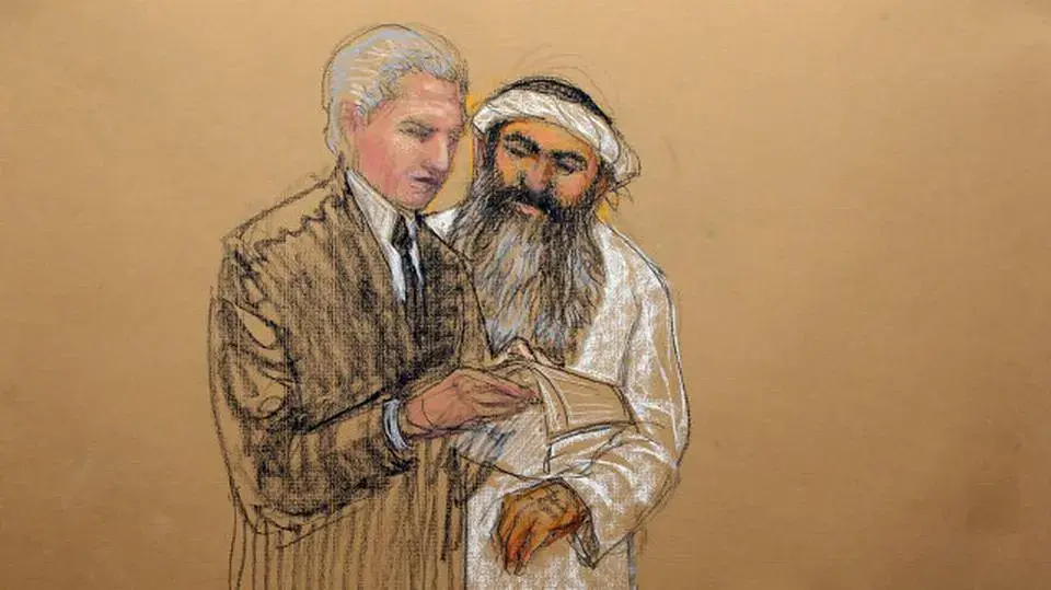 In this sketch by courtroom artist Janet Hamlin and reviewed by the U.S. Department of Defense, Khalid Sheik Mohammed, right, consults with his civilian attorney David Nevin during a break of his military hearing at the U.S. Navy base at Guantanamo Bay. Image by Janet Hamlin. Cuba, 2012. In this sketch by courtroom artist Janet Hamlin and reviewed by the U.S. Department of Defense, Khalid Sheik Mohammed, right, consults with his civilian attorney David Nevin during a break of his military hearing at the U.S. Navy base at Guantanamo Bay. Image by Janet Hamlin. Cuba, 2012.