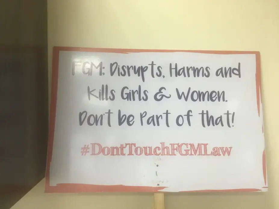 A sign found at Equality Now in Nairobi, a non-governmental international women's rights organization, describes the effects of FGM and urges people to fight against it. Image by Merdie Nzanga. Kenya, 2018. A sign found at Equality Now in Nairobi, a non-governmental international women's rights organization, describes the effects of FGM and urges people to fight against it. Image by Merdie Nzanga. Kenya, 2018.