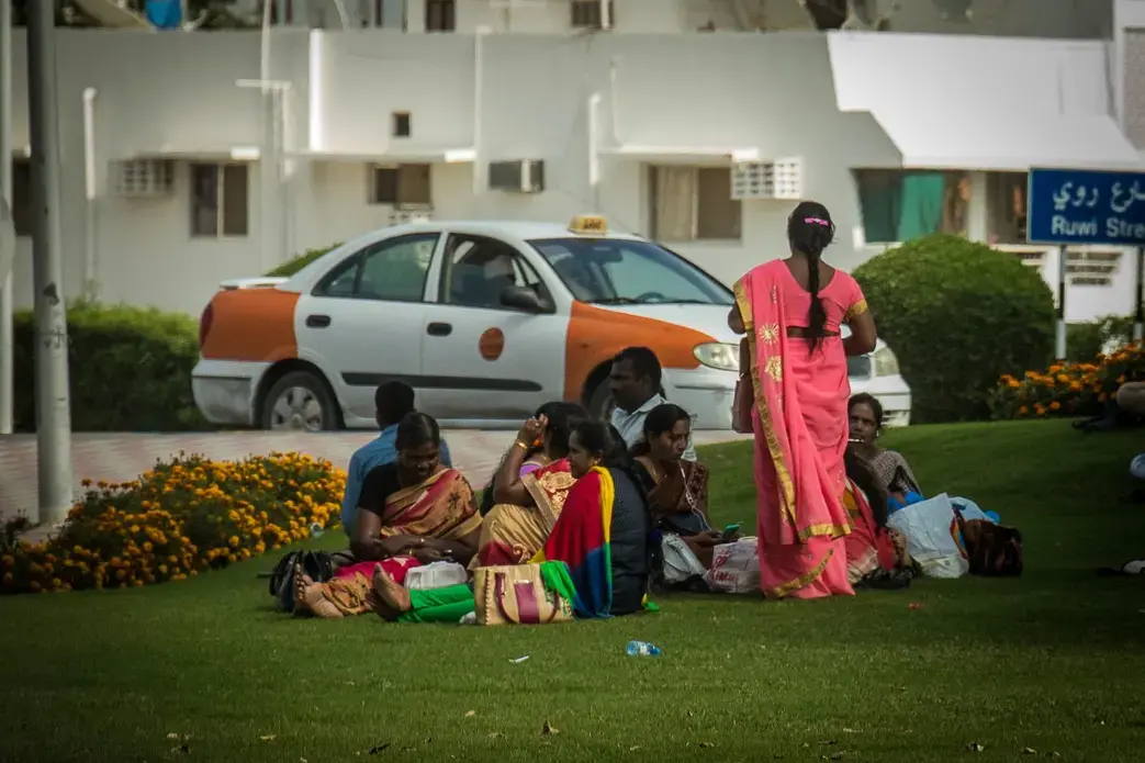 Indian and Sri Lankan domestic workers catch up with each other in a local park in Muscat. Image by Svanika Balasubramanian. Oman, 2019. Indian and Sri Lankan domestic workers catch up with each other in a local park in Muscat. Image by Svanika Balasubramanian. Oman, 2019.