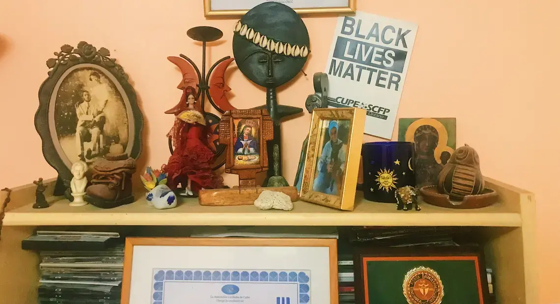 Black Lives Matter poster from a rally in Ontario, Canada, is displayed among some of documentary-filmmaker Gloria Rolando's possessions in Havana. Image by Esohe Osabuohien. Cuba, 2018. Black Lives Matter poster from a rally in Ontario, Canada, is displayed among some of documentary-filmmaker Gloria Rolando's possessions in Havana. Image by Esohe Osabuohien. Cuba, 2018.