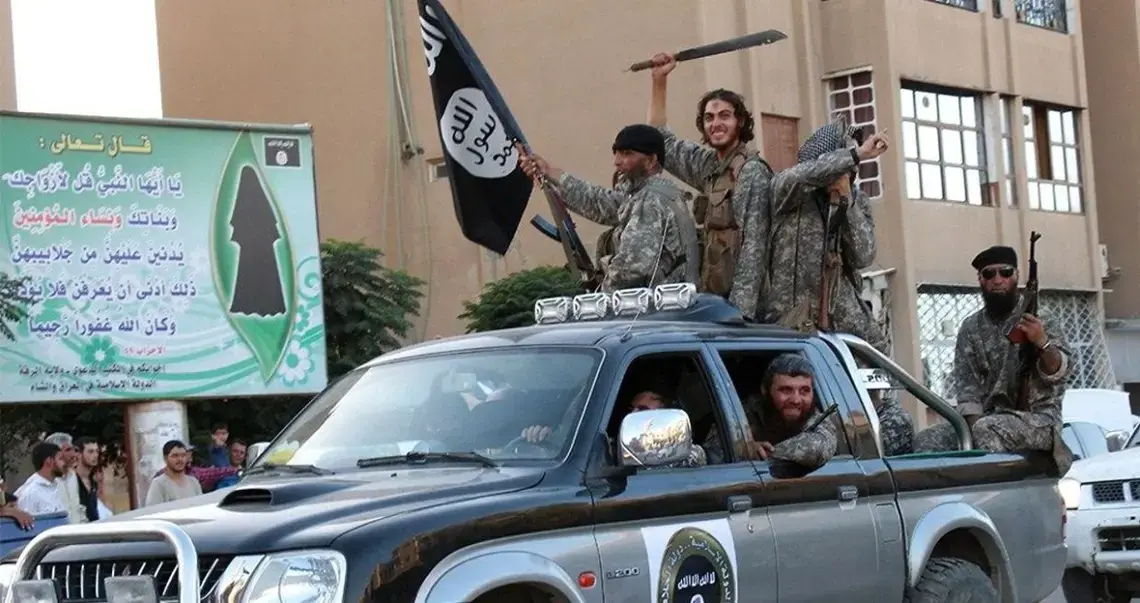 ISIL fighters parade through Raqqa, Syria, in a caravan of Toyota pickup trucks, 2014 ISIL fighters parade through Raqqa, Syria, in a caravan of Toyota pickup trucks, 2014