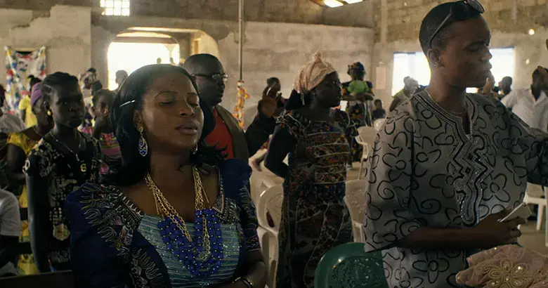 Every Sunday, Mabel Musa attends church praying for her patients to stop dying from Ebola. Image by DOCDAYS Productions/Carl Gierstorfer. Liberia, 2015. Media file: gierstorfer-ebola-film-news.jpg