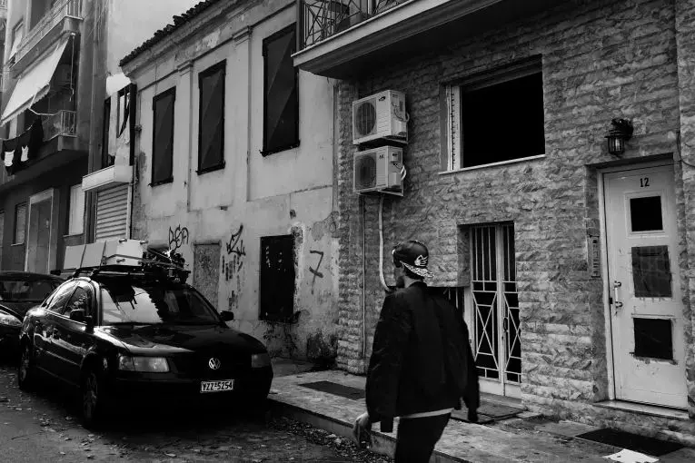 A young Iranian refugee revisits the shelter where he lived as an unaccompanied minor in Athens. It is managed by the Greek organization Nostos. Image by Divya Mishra. Greece, 2018. 