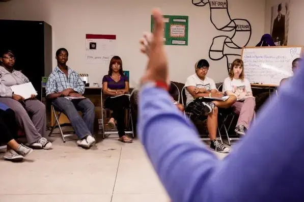 Pulitzer Center journalist Lisa Armstrong speaks with high school students at Free Spirit Media's summer documentary filmmaking workshop. Image by Jake Naughton. Chicago, 2012. Media file: free.spirit.media_.jake_.naughton.jpg