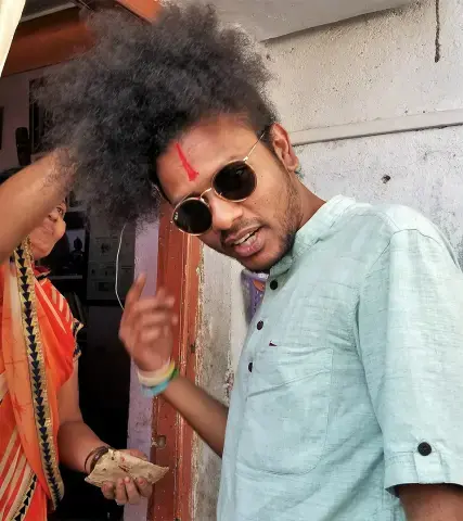 Suraj Yengde greeted by his mother in Nanded. Image by Phillip Martin/WGBH News. India, 2019.