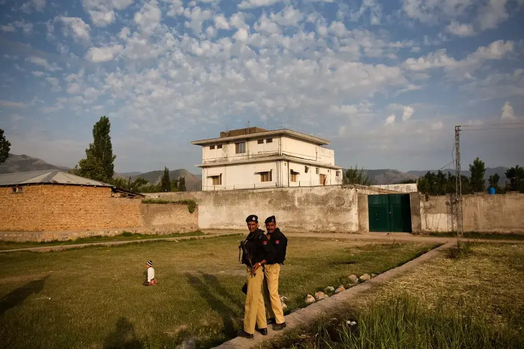 Police guard the compound in Abbottabad, Pakistan, where Osama bin Laden was killed by U.S. Navy SEALs on May 2, 2011. In the weeks leading up to the raid, a Pakistani doctor attempted to access the compound and was able to provide vital information to the CIA. Image by Warrick Page, Redux Media file: 01polio_2_pakistan_binladen.adapt_.1190.1.jpg
