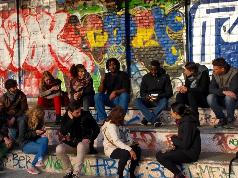 Refugees from Somalia and South Sudan share their stories during a solidarity walking tour in Berlin. Image by Ben Mauk. Germany, 2016. Refugees from Somalia and South Sudan share their stories during a solidarity walking tour in Berlin